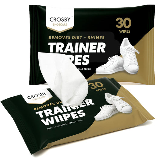 Two packages of Crosby Trainer Wipes with white sneakers on a white background